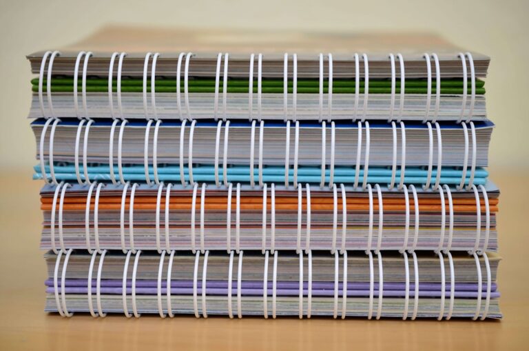 tps four notebooks stacked upon each other